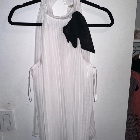 White top with black tie. - Picture 2 of 3